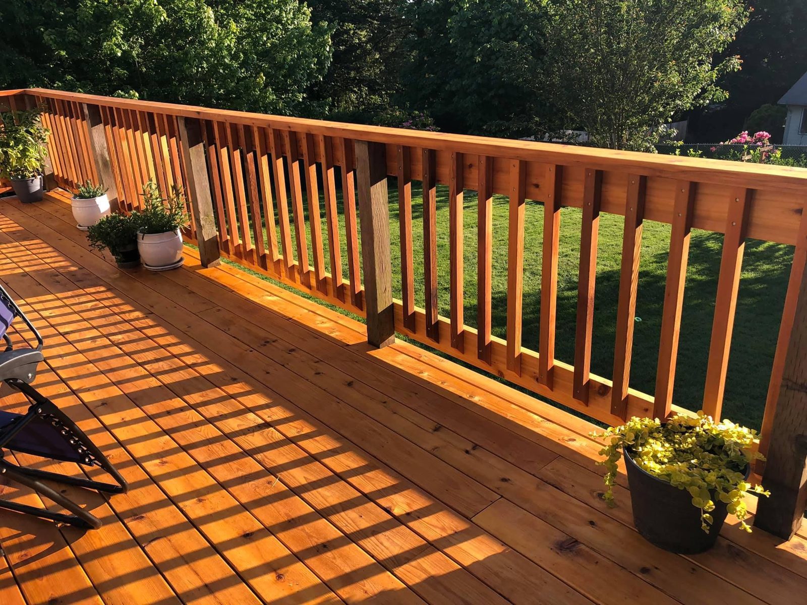Cedar deck railing in late light